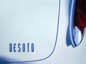 Oil painting of a vintage pale-blue DeSoto, showing the badge and tail fin