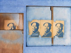 Oil painting of Mao Zedong posters on a wall